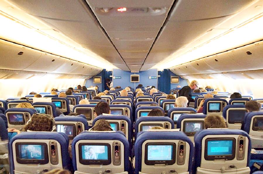 Economy seat rows in a KLM flight